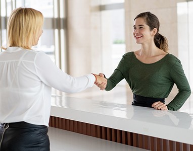 Patient and dentist discussing how to make cosmetic dentistry affordable in Wauwatosa 