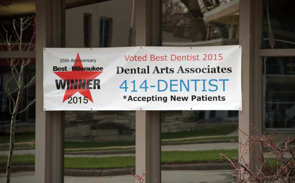 Voted best dentist sign on dental office building